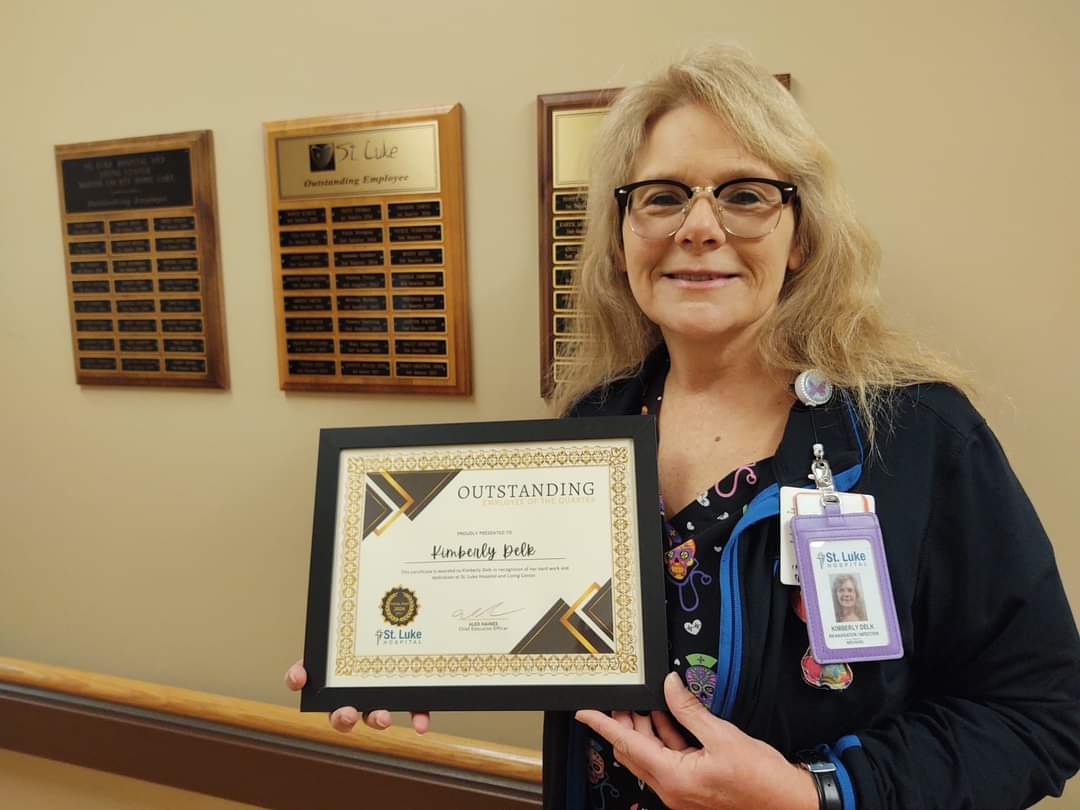 Kim Delk, RN Navigator, Recognized as Employee of the Quarter, February 2024Kim Delk Holding Employee of the Quarter Certificate February 2024